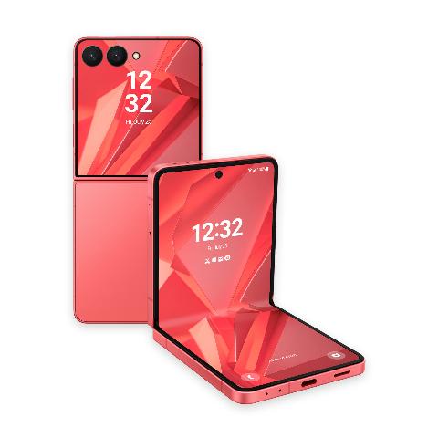 Two coral red flip phones displaying an abstract geometric background with sharp, overlapping red and coral crystal facets on their lock screens.