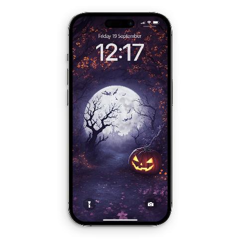 iPhone lock screen mockup displaying artwork of a glowing jack-o'-lantern on a cobblestone path beneath a full moon, gnarled tree, bats, and violet forest canopy.