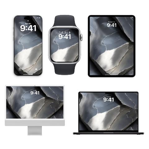 Five Apple devices: an iPhone, Apple Watch, iPad, iMac, and MacBook, all displaying a wallpaper that features fractured planes of dark gray, bright white, and silvery metallic textures.