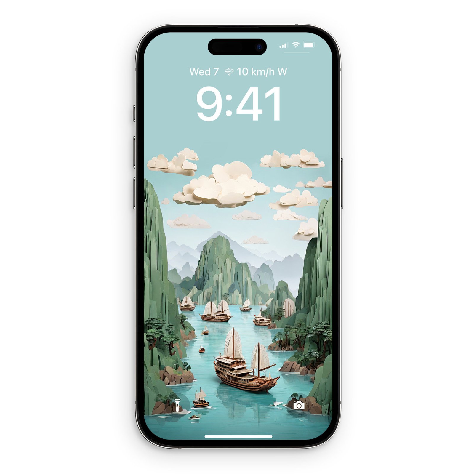 iPhone lock screen displaying a multi-layered papercraft illustration of Ha Long Bay, Vietnam. Pale turquoise sky with cream-colored clouds at the top, deep forest green limestone peaks in the middle, and turquoise water with wooden junks in the foreground. Each element appears as a separate cut pap