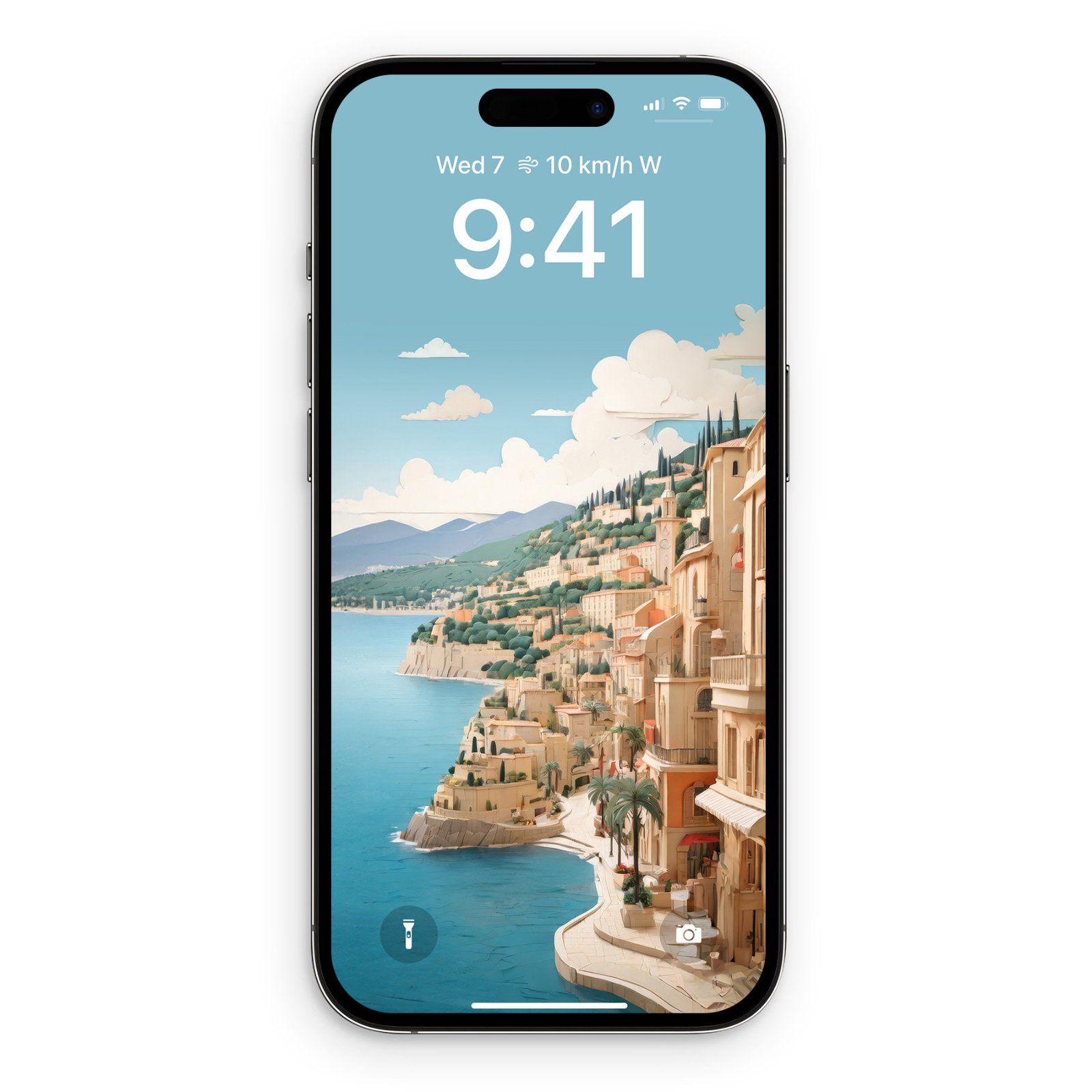 iPhone displaying a papercraft-style illustration of the French Riviera with stacked terracotta buildings on a cliffside, turquoise Mediterranean water below, soft white clouds, distant mountains, and a calm blue sky. The time shown is 9:41.
